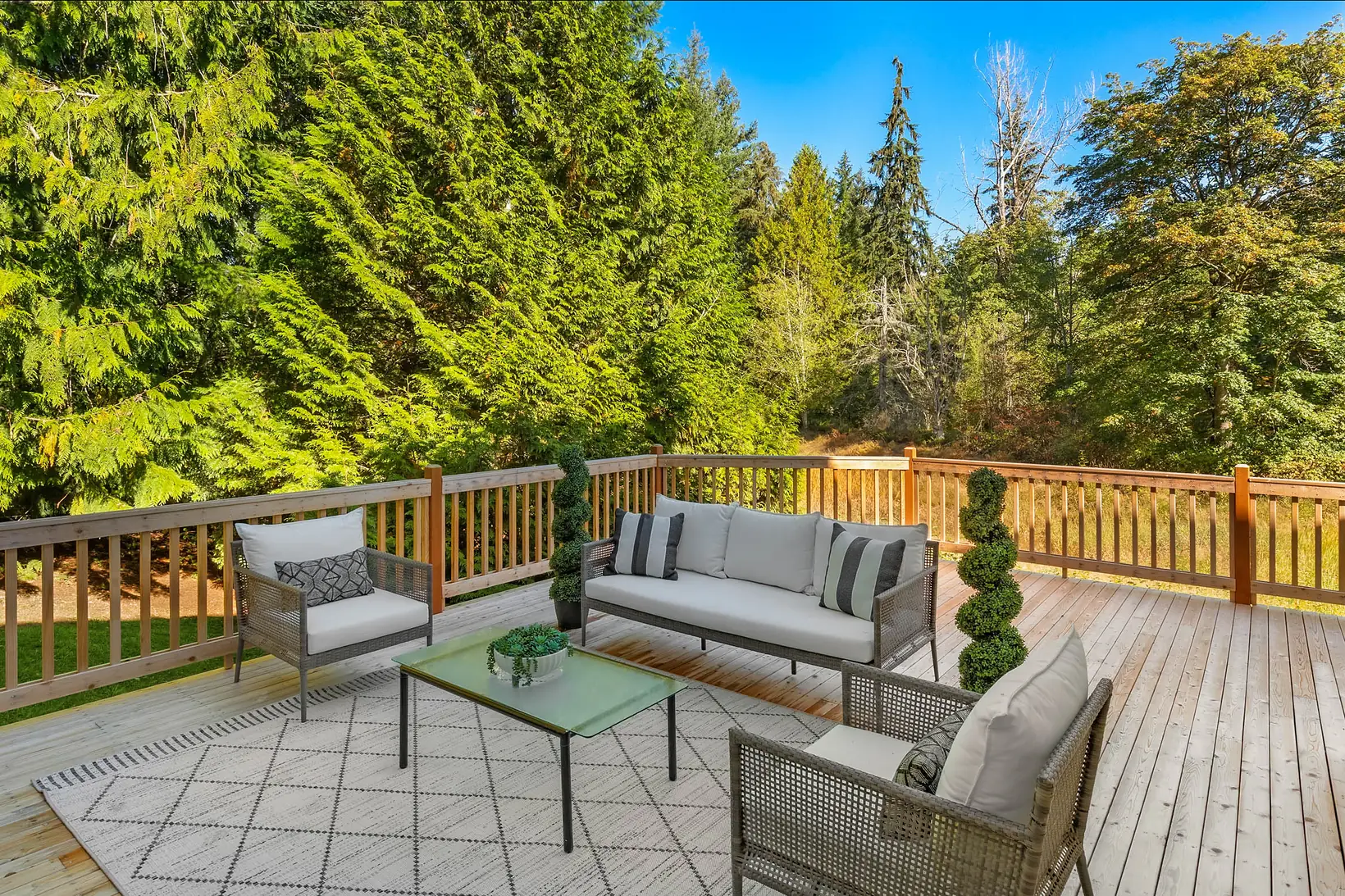 New cedar deck overlooking mature trees and open space behind 7229 245th Way NE